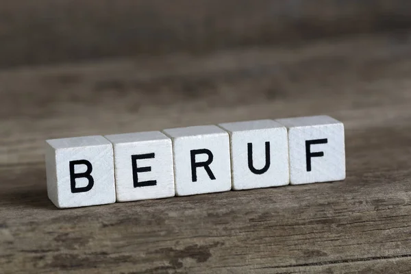 Mot allemand profession, écrit en cubes — Photo