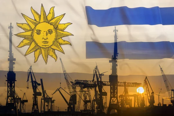 Konsep industri dengan bendera Uruguay saat matahari terbenam — Stok Foto