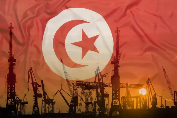 Industrial concept with Tunisia flag at sunset — Stock Photo, Image