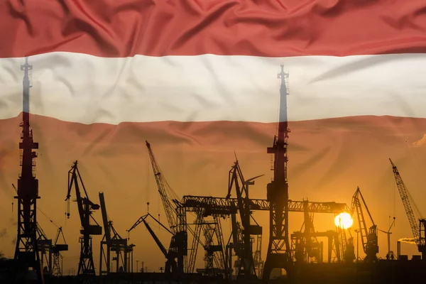 Industriële concept met Letland vlag bij zonsondergang — Stockfoto