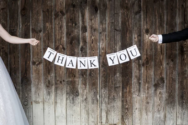 Bridal couple with thank you sign — Stock Photo, Image