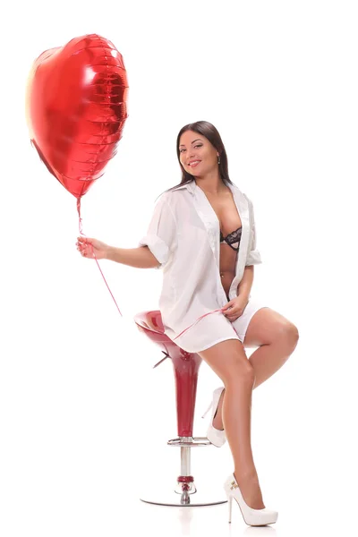 Girl with an inflatable heart — Stock Photo, Image