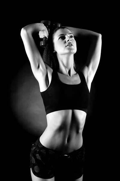 Woman lifting dumbbells — Stock Photo, Image