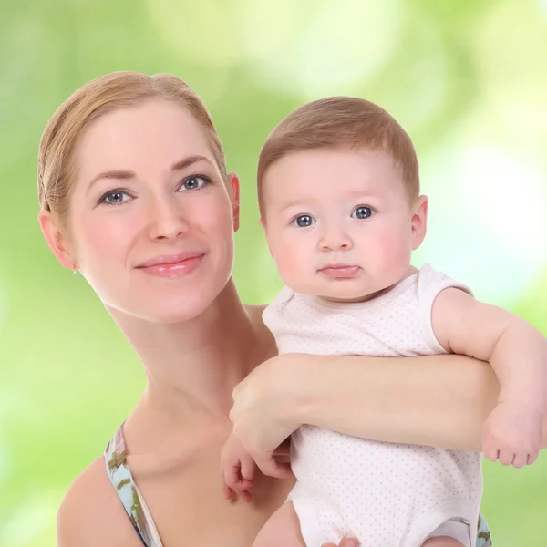 Happy mother holding her baby — Stock Photo, Image