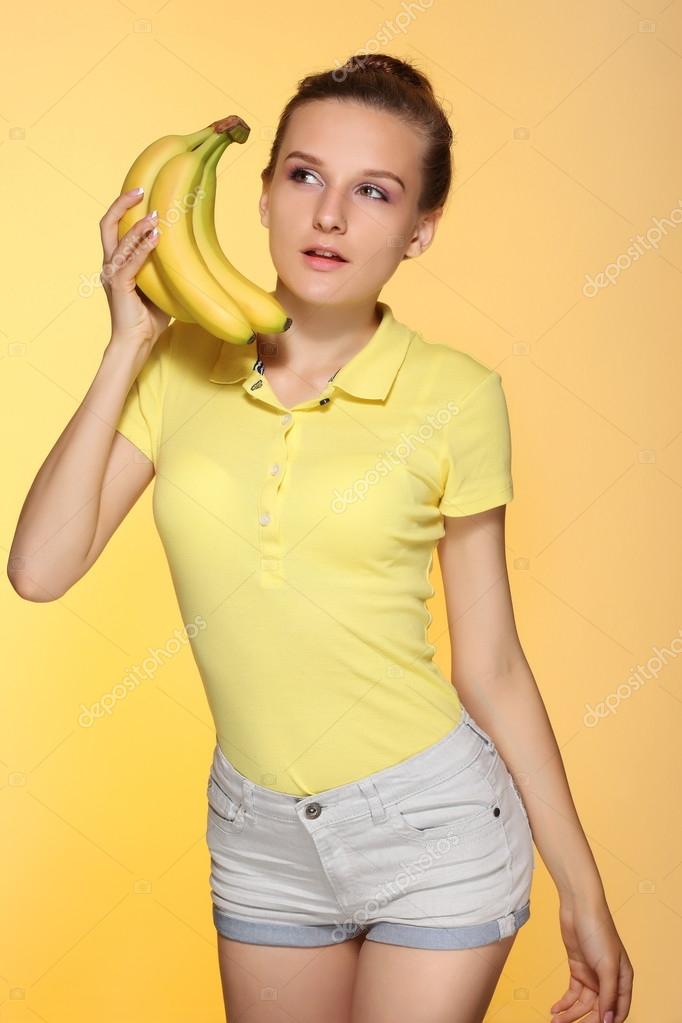Beautiful young woman with bananas Stock Photo by ©zhagunov 125600362
