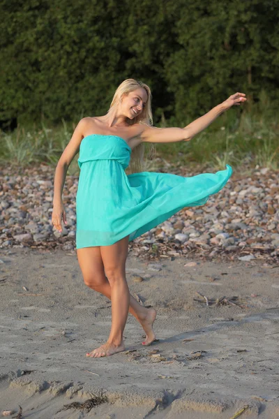 Young women in blue dress — Stock Photo, Image