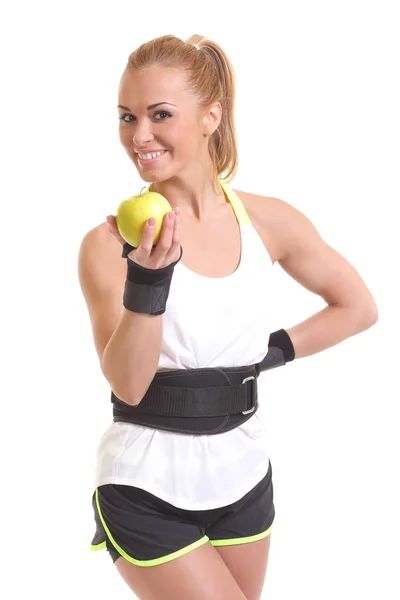 年轻的健身女人快乐微笑控股苹果 — 图库照片