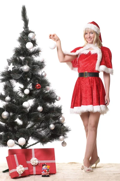 Mulher em roupas de Papai Noel com presentes — Fotografia de Stock