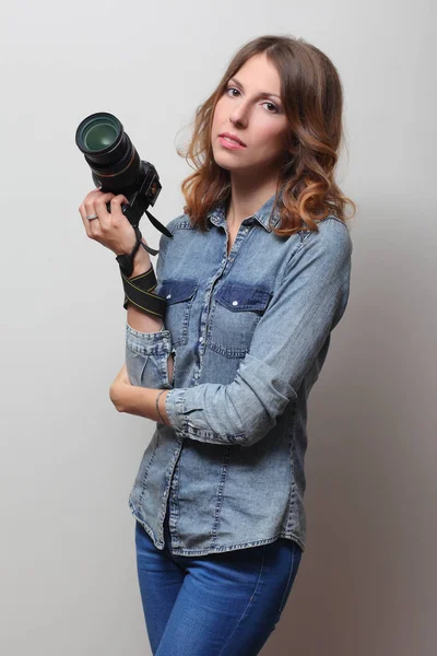 Photographer holding a film camera in hands — Stock Photo, Image