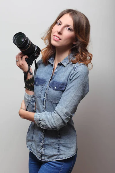 Photographer holding a film camera in hands — Stock Photo, Image