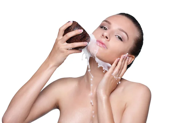 Beautiful woman pour milk on face — Stock Photo, Image
