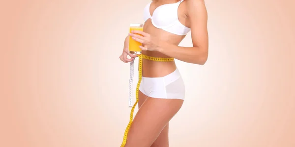 Girl in white underwear measures her waist — Stock Photo, Image