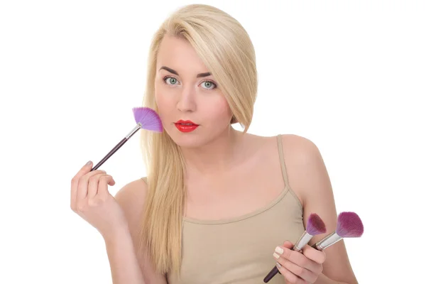 Portrait of beautiful woman with makeup brush — Stock Photo, Image