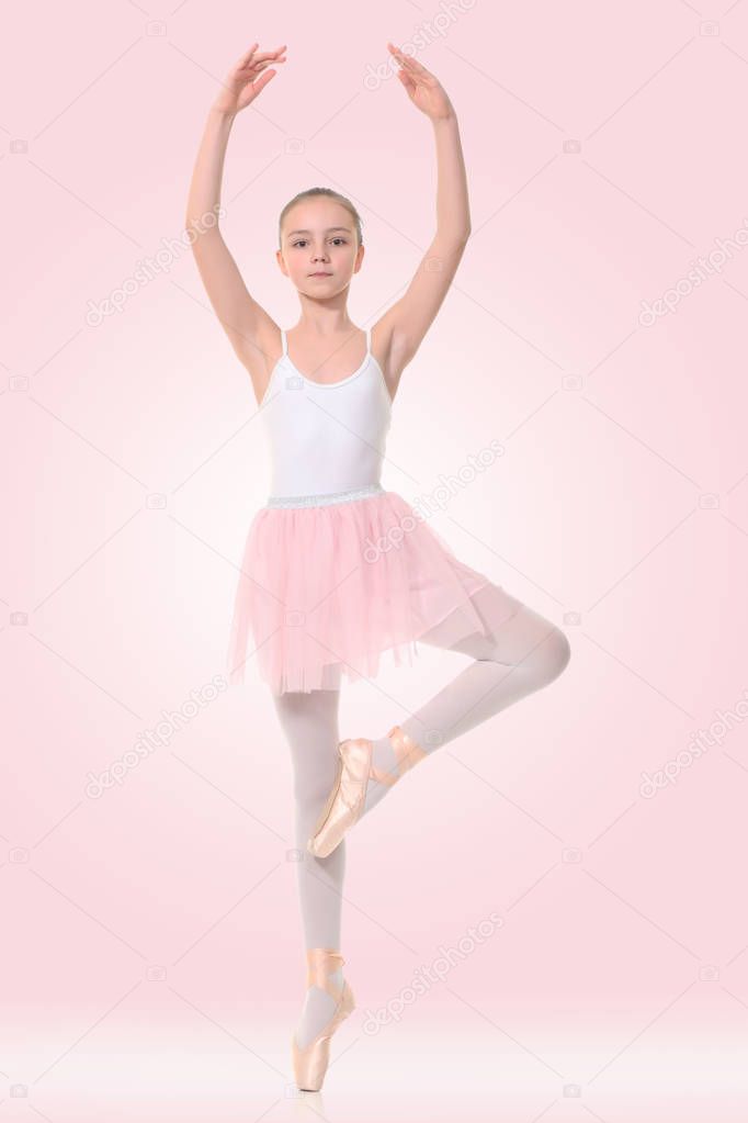 little ballerina on a pink background