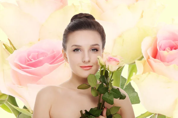 Young beautiful woman with a rose — Stock Photo, Image