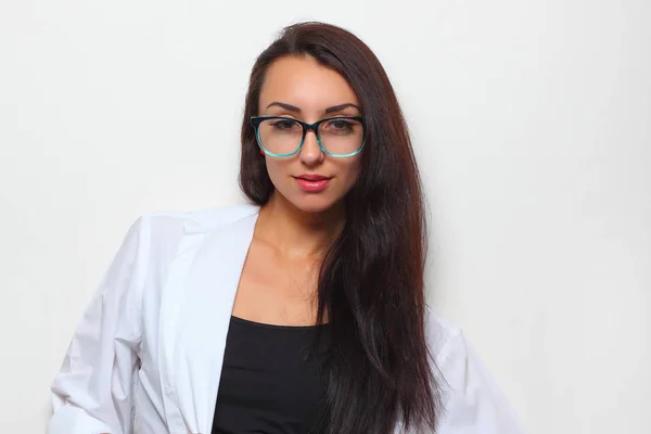 Young girl in stylish glasses on a light background — Stock Photo, Image