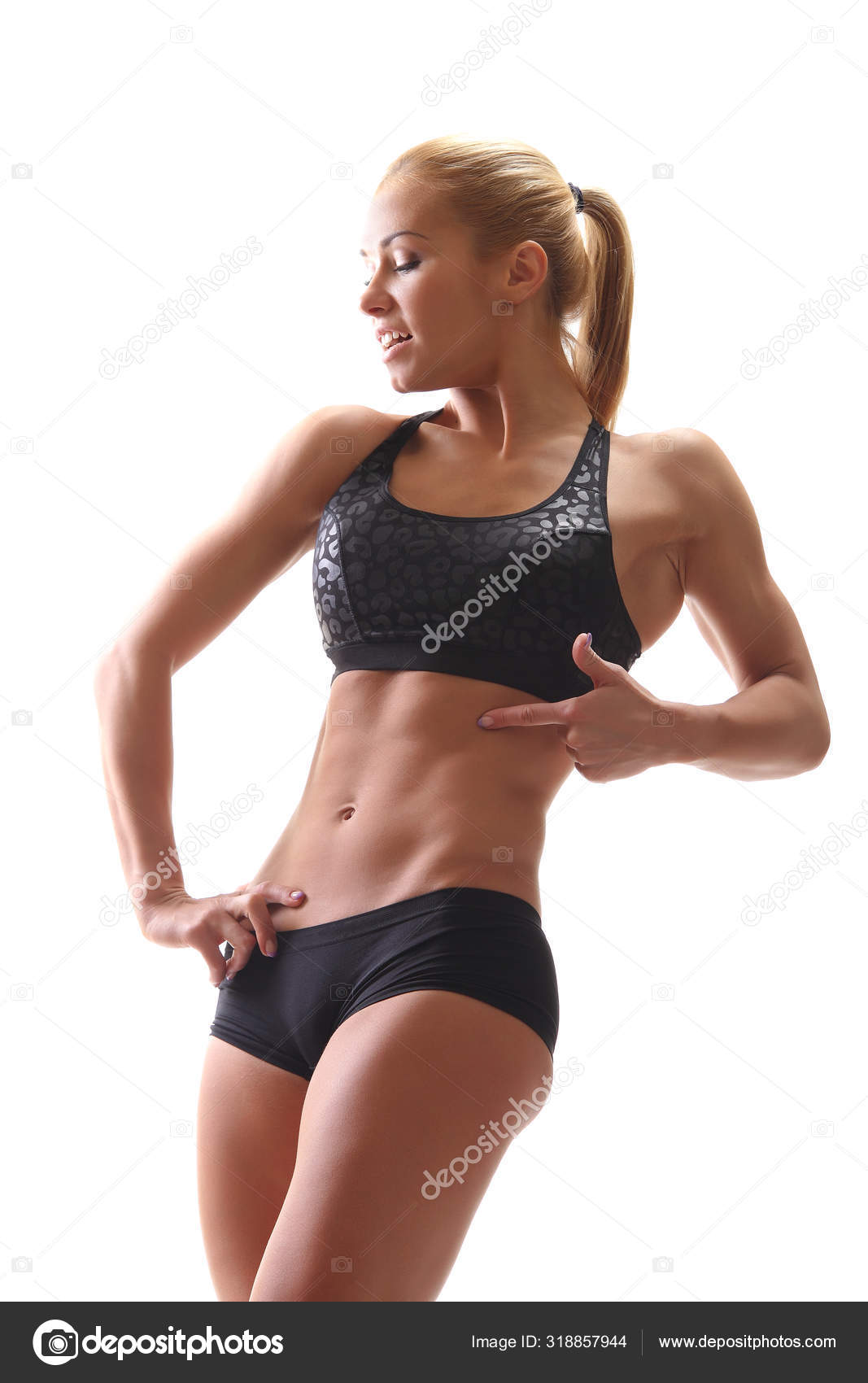 Young athletic muscular female body Stock Photo by ©zhagunov 318857944