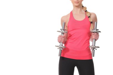 Güzel genç kadın egzersiz dumbbells ile