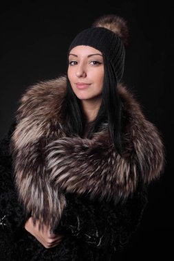 young girl in woolen hat and fur coat