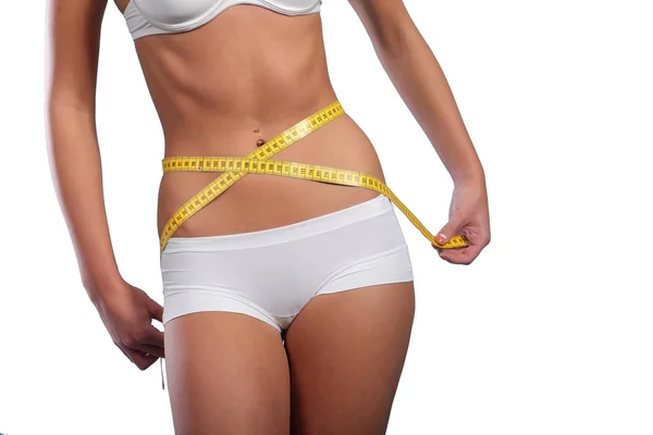 Woman measuring her slim body — Stock Photo, Image