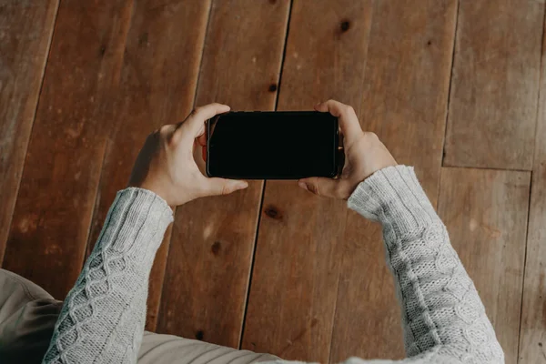 Hands with a black phone. smart phone