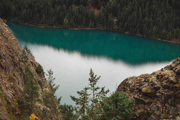 Diablo lake. North Cascade National Park. Beautiful blue lake. Lake in the mountains of extraordinary beauty. Reflection in the lake.Turquoise color of water. 