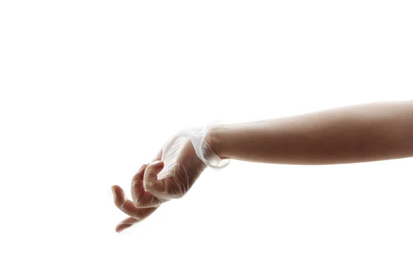 Schützen Sie Ihre Hände vor Keimen. Eine Hand in einem weißen, transparenten Latex-Handschuh reicht sich die Hand. Stockbild