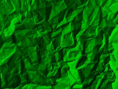 Direkt olarak kullanılabilen veya koyu yeşil arkaplan olarak kullanılabilen buruşmuş kağıt dokusu resmi