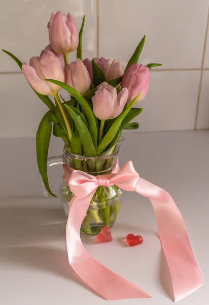 Bouquet of pink tulips with hearts