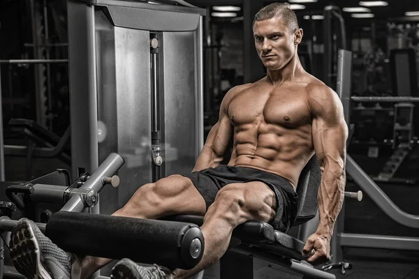 Portrait Of A Physically Young Man Holding Weights In Hand (dalam bahasa Inggris) — Stok Foto