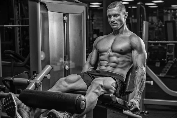 Portrait Of A Physically Young Man Holding Weights In Hand (dalam bahasa Inggris) — Stok Foto