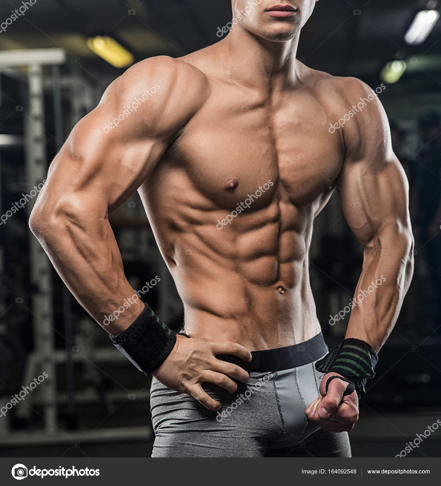 Attractive tall muscular bodybuilder doing heavy deadlifts in mo Stock