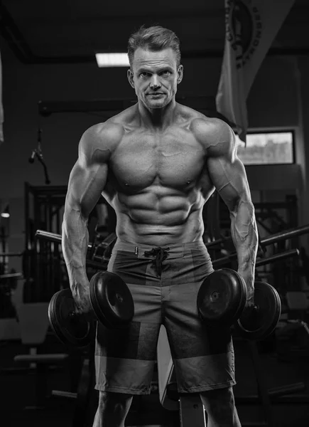 Brutal strong athletic men pumping up muscles workout bodybuildi — Stock Photo, Image