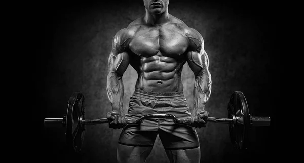 Brutal handsome Caucasian bodybuilder working out training in th — Stock Photo, Image