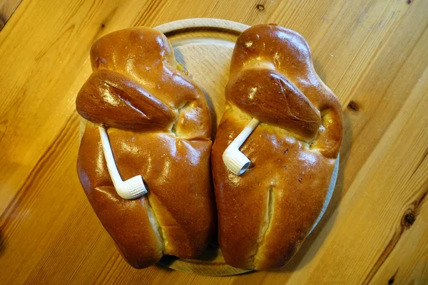 Martinsweck or Weckmann with clay pipe, baked from the dough, specialty from the Rhineland, North Rhine-Westphalia, Germany