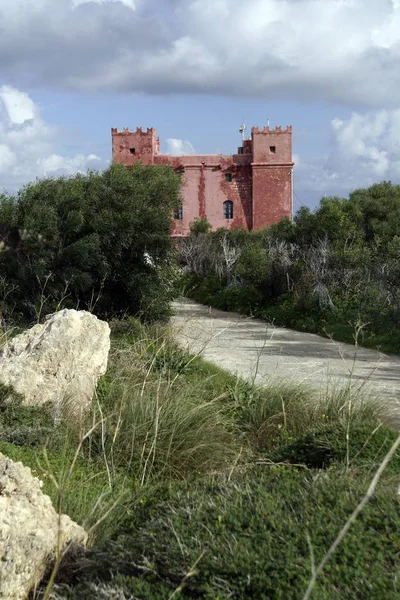 Red Tower or St. Agatha Tower, in Maltese Din l-Art Helwa, historic defense tower of the Order of Malta on the Marfa Ridge, Mellieha, Malta