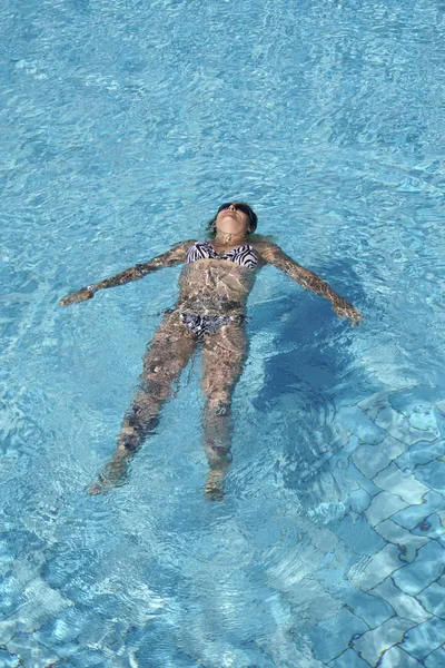 Young woman in bikini on water, El Quseir, Egypt