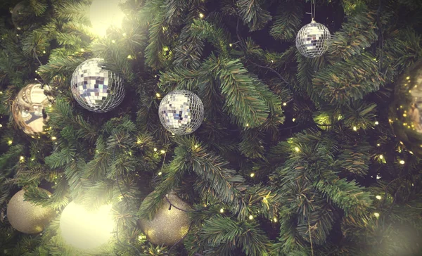 Decorated Christmas tree on blurred, sparkling background — Stock Photo, Image