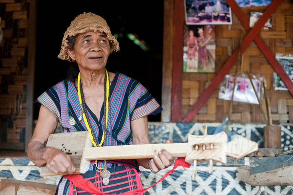 Unidentified Alak tribe woman in village near plateau Bolaven