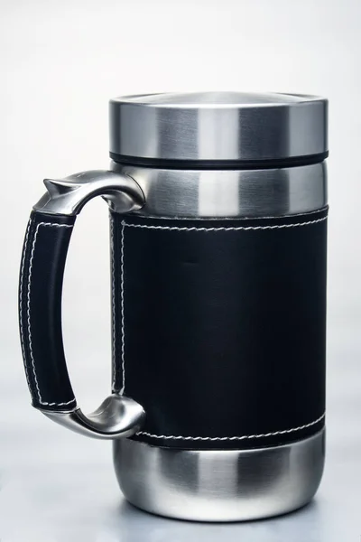 thermos mug with leather trim on white background