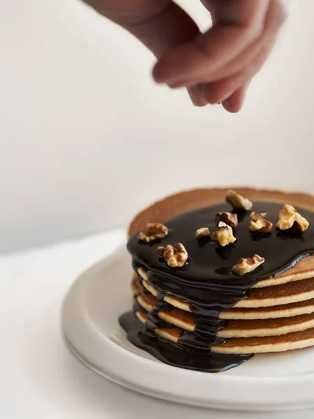 Pancakes Dressing Chocolate Nuts White Plate White Background — Stock Photo, Image