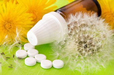 Homeopathy - globules and pills clipart