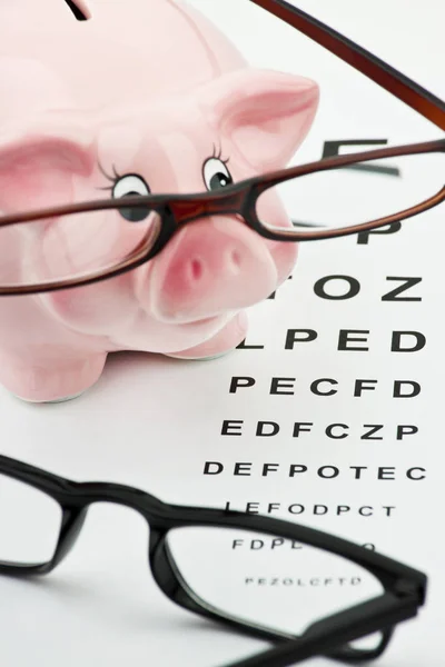 Glasses and piggy bank — Stock Photo, Image