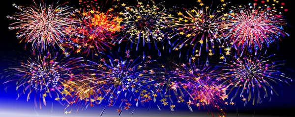 Night fireworks with blue and black sky — Stock Photo, Image