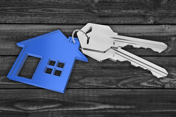 Ahşap arka planda ev kolyesi olan 3D anahtarlık.