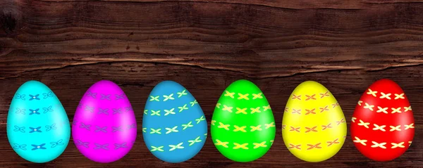 Uovo di Pasqua colorato con banner motivo su sfondo di legno — Foto Stock
