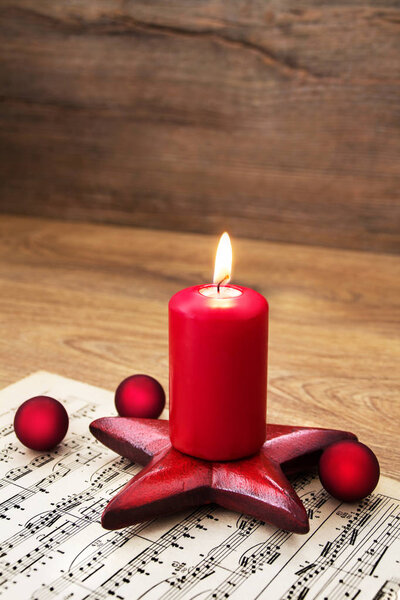 Christmas decoration with candle and musical notes