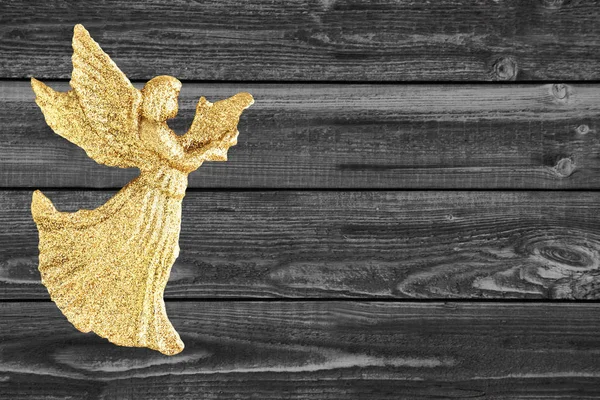 Zlatý Anděl na dřevěné pozadí — Stock fotografie