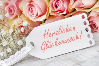 Pembe güller için Almanca tebrikler.