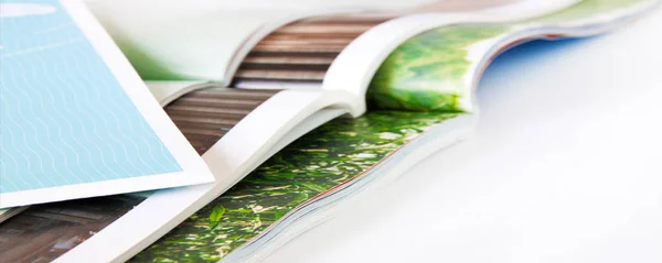 Stack of magazines with white background — Stockfoto